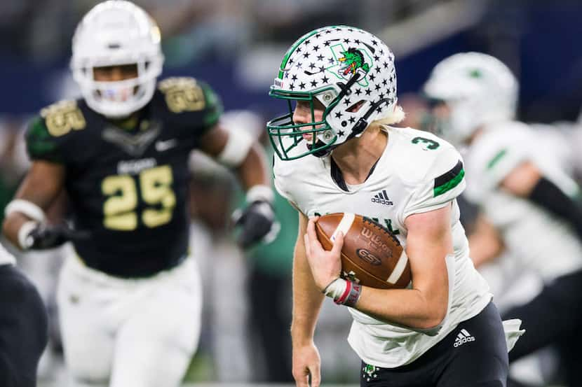 Southlake Carroll quarterback Quinn Ewers (3) runs the ball during the fourth quarter of a...