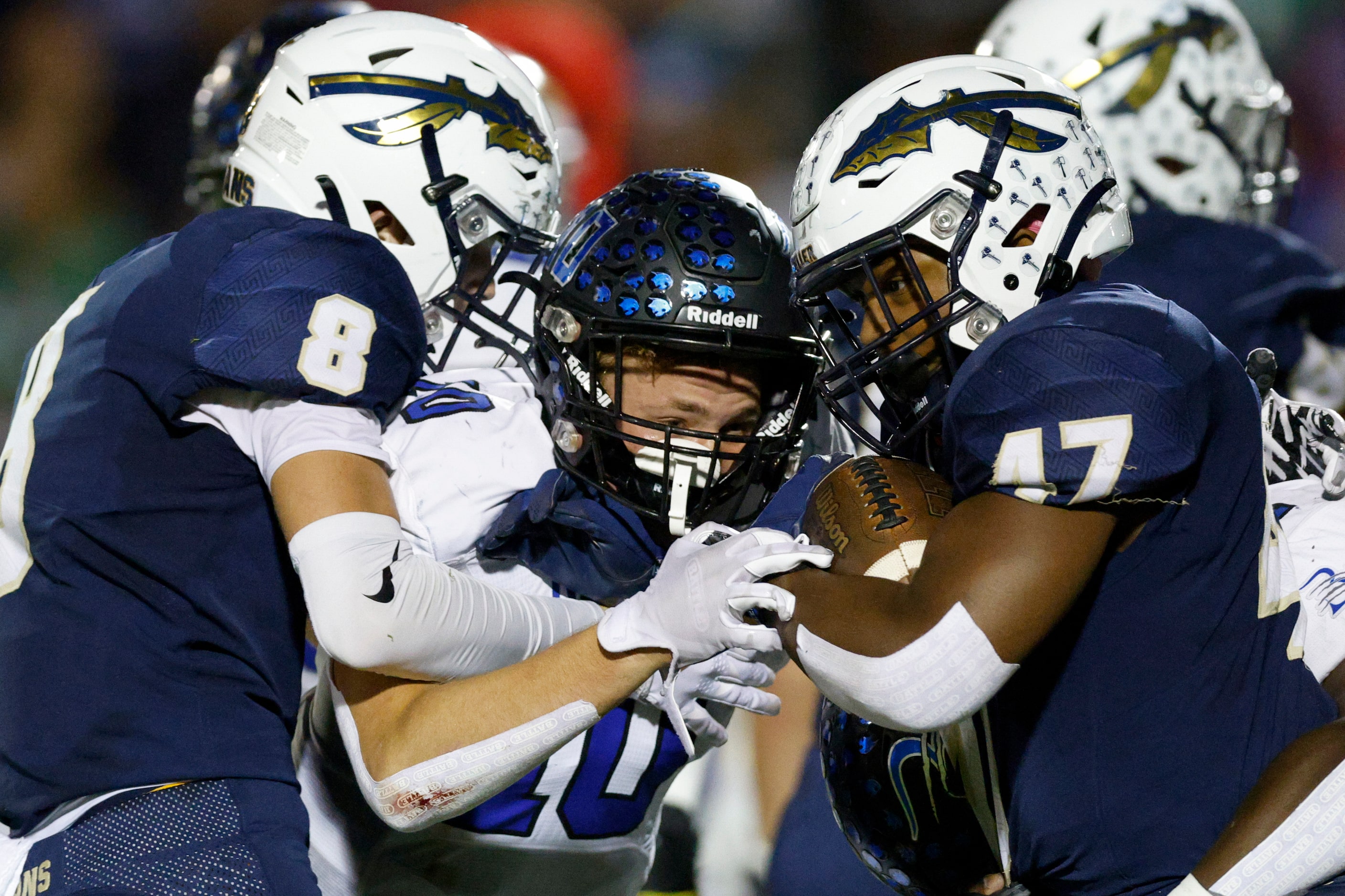 Keller Wide receiver Parker Ireson (8) blocks Trophy Club Byron Nelson’s William Scullin...