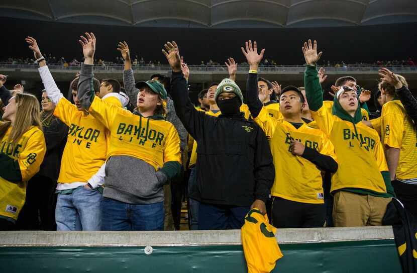 Baylor Bears fans sing the school song after losing 34-31 to the Oklahoma Sooners after an...