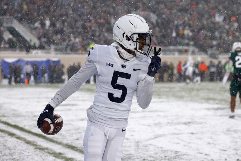Penn State's Jahan Dotson reacts after scoring a touchdown on a pass reception against...