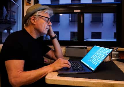 Steve Miller of the Steve Miller Band checks his emails on his tour bus before his concert...