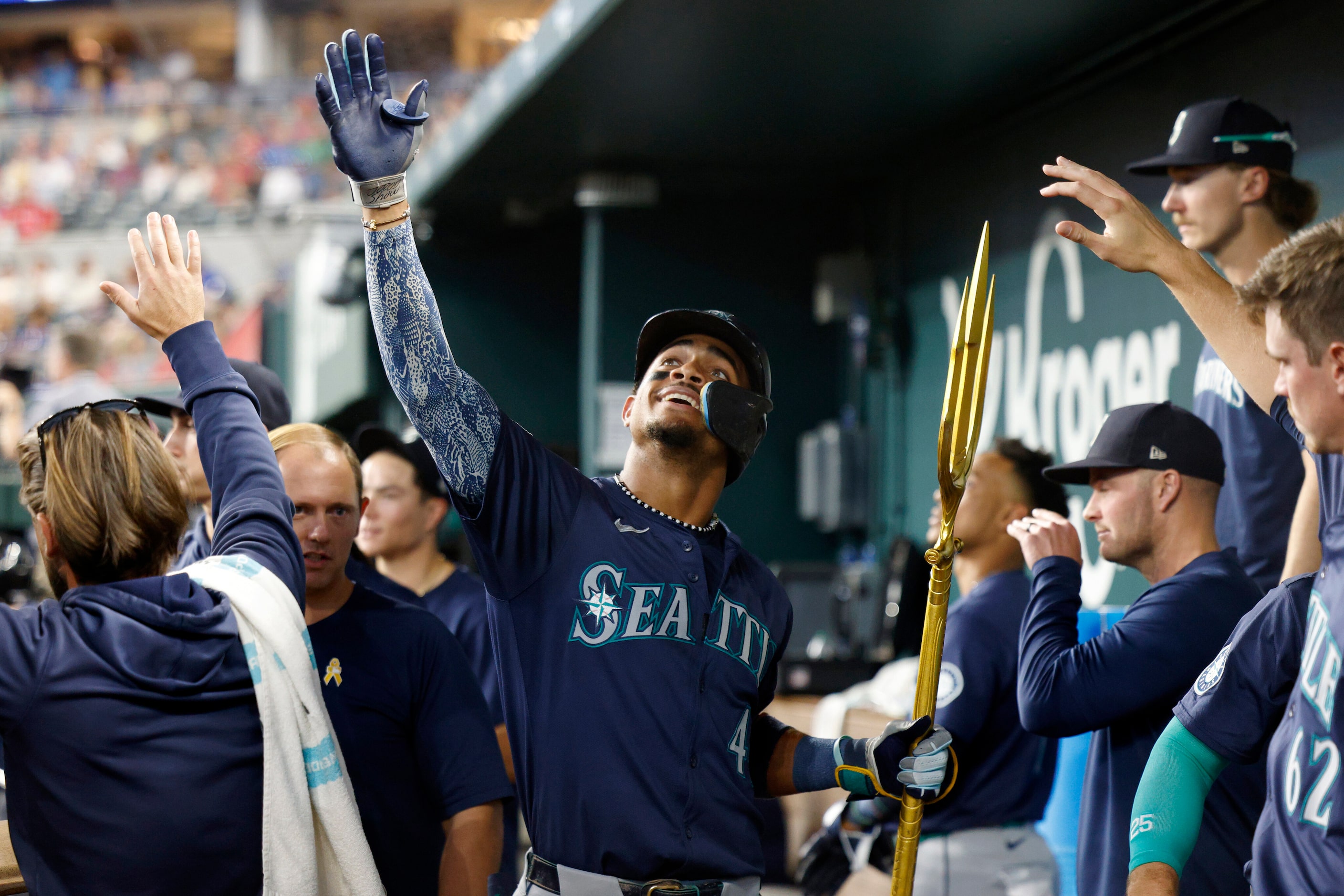 Seattle Mariners center fielder Julio Rodriguez (44) celebrates his solo home run with the...