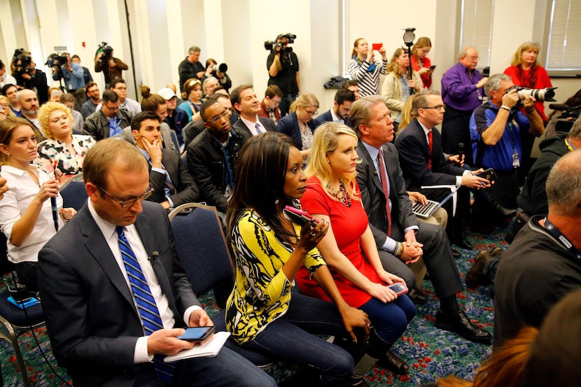 KLIF radio show host Nicole Barrett (second from right in yellow top) asked a question of...