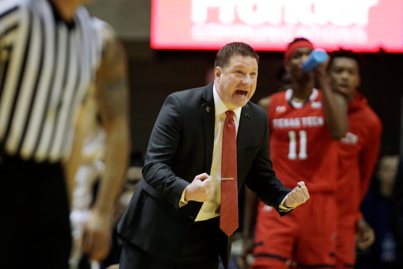 Texas Tech head coach Chris Beard yells instructions to his players during the first half of...