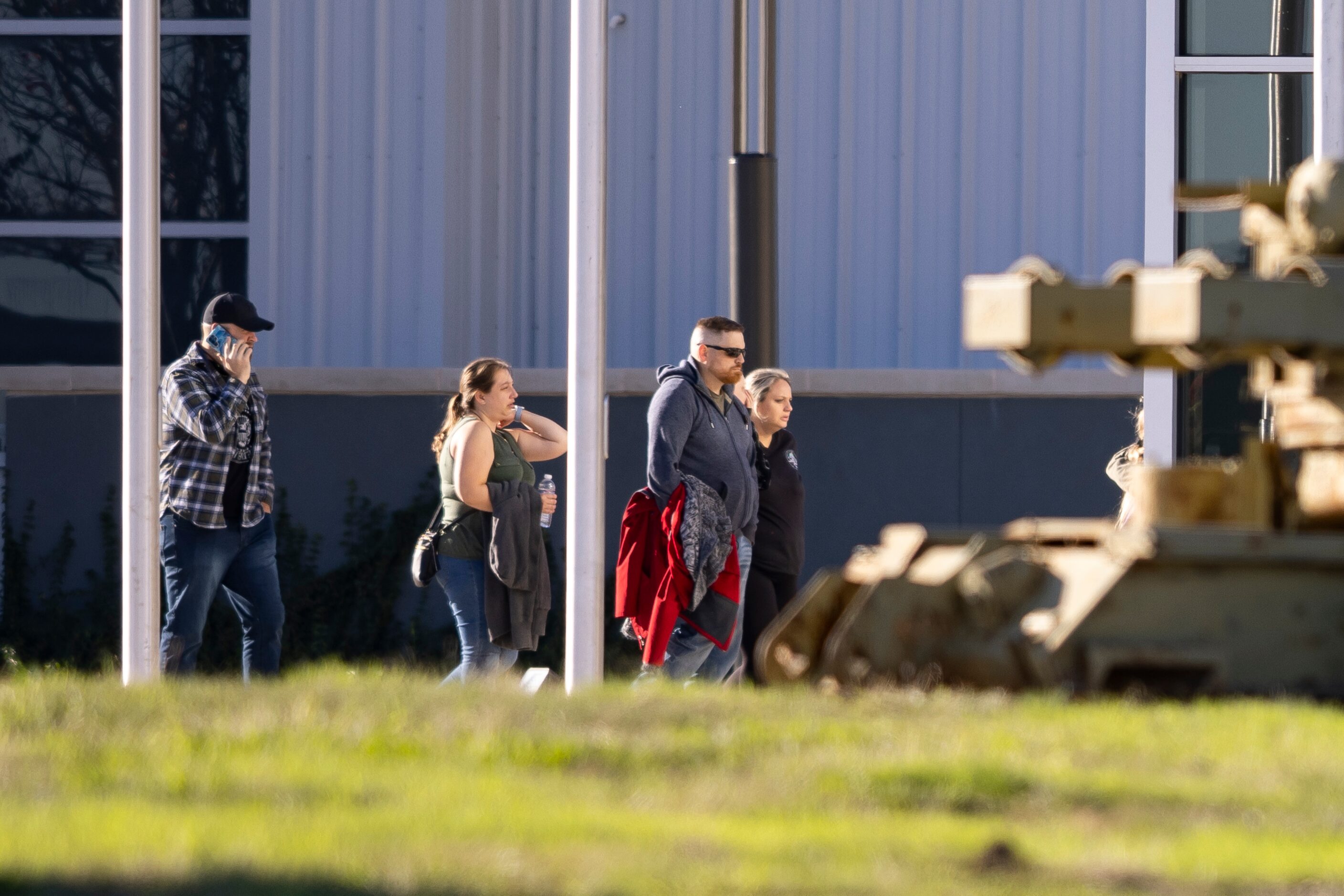 People leave after a mid-air collision between two planes during a Commemorative Air Force...