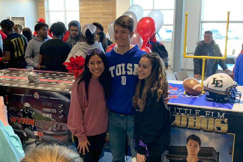 Little Elm kicker Tyler Tipton poses with friends after signing his National Letter of...