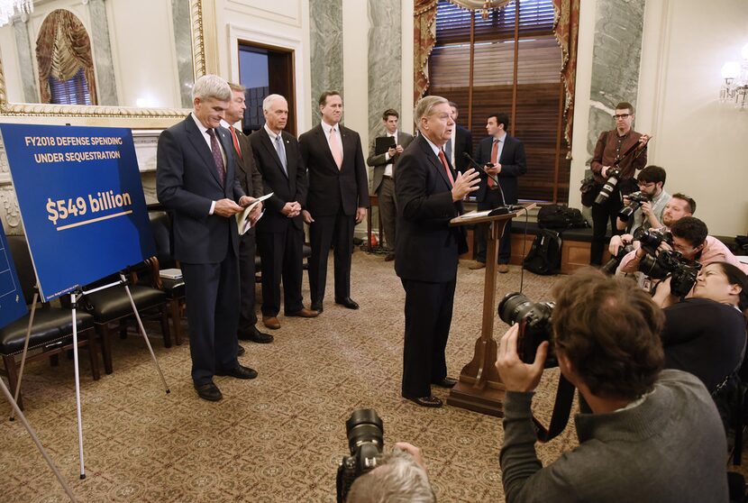 U.S. Sen. Lindsey Graham (R-S.C.) speaks as Sen. Bill Cassidy (R-La.), Sen. Dean Heller...