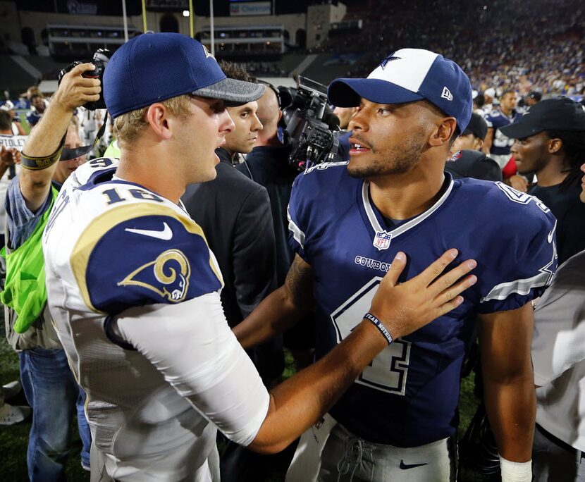 Dallas Cowboys quarterback Dak Prescott (4) and Los Angeles Rams quarterback Jared Goff (16)...