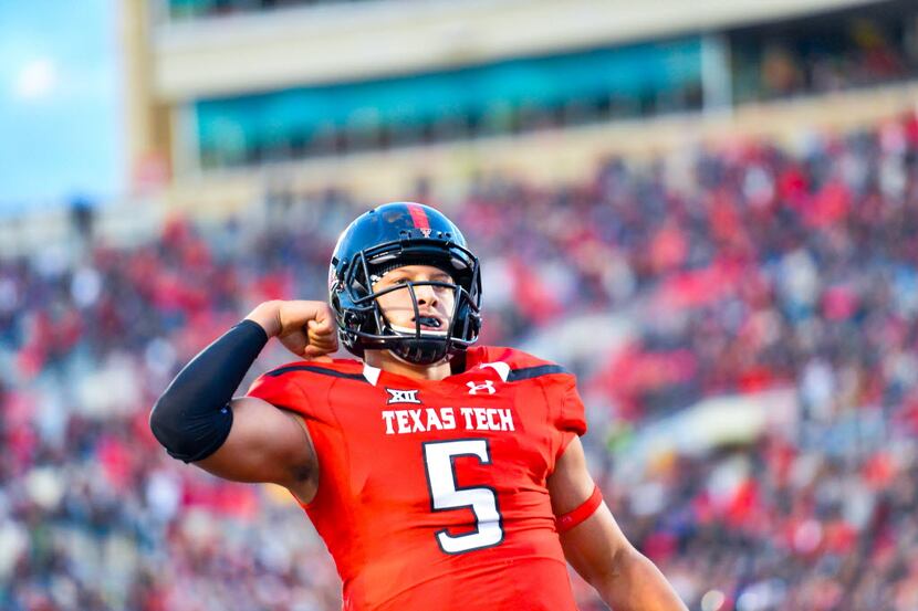 Patrick Mahomes #5 of the Texas Tech Red Raiders celebrates  touchdown during the fourth...
