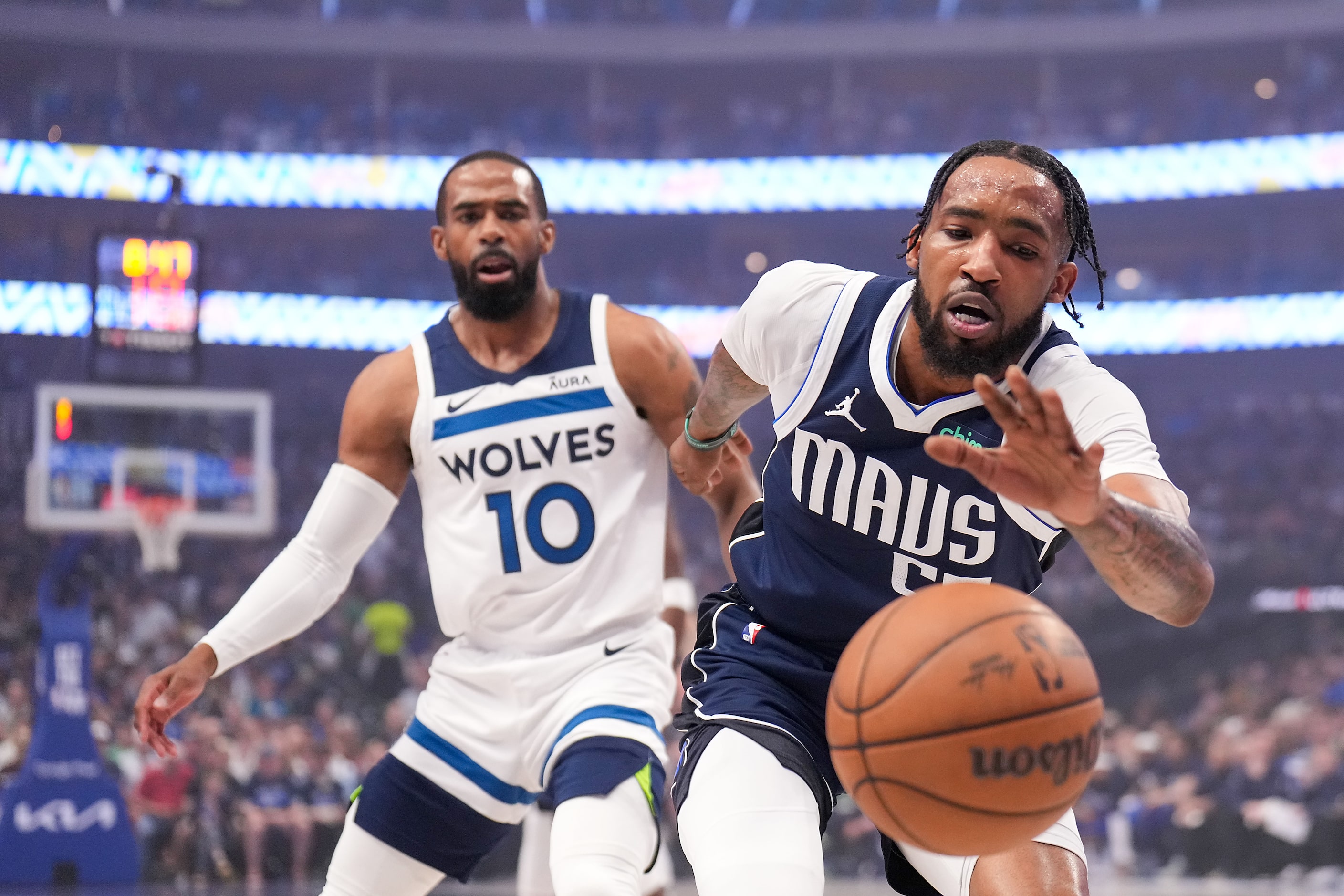 Dallas Mavericks forward Derrick Jones Jr. (55) chases a loose ball against Minnesota...