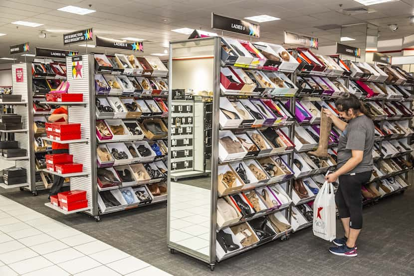 Carmen Patlan shopping for women's shoes in the new Macy's Backstage Town East Mall which...