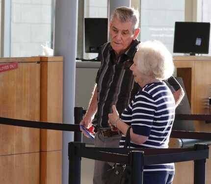 Christina Morris' grandparents, David and Linda Morris, waited to go through security at the...