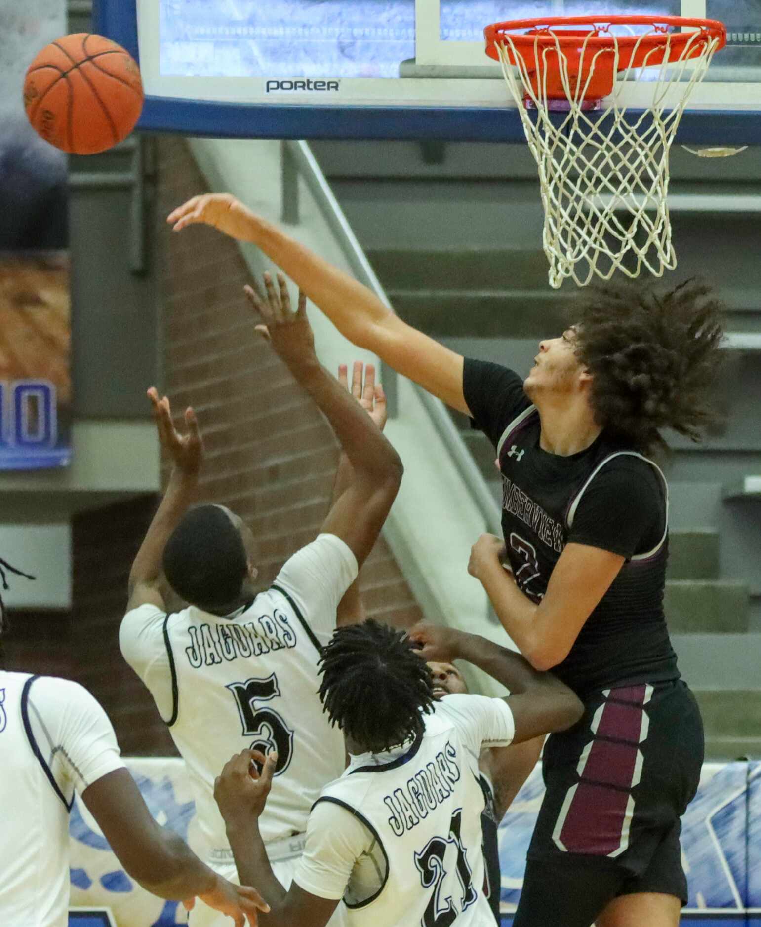 Mansfield Timberview guard Cameron Taylor (2) blocks the shot of Mansfield Summit guard...