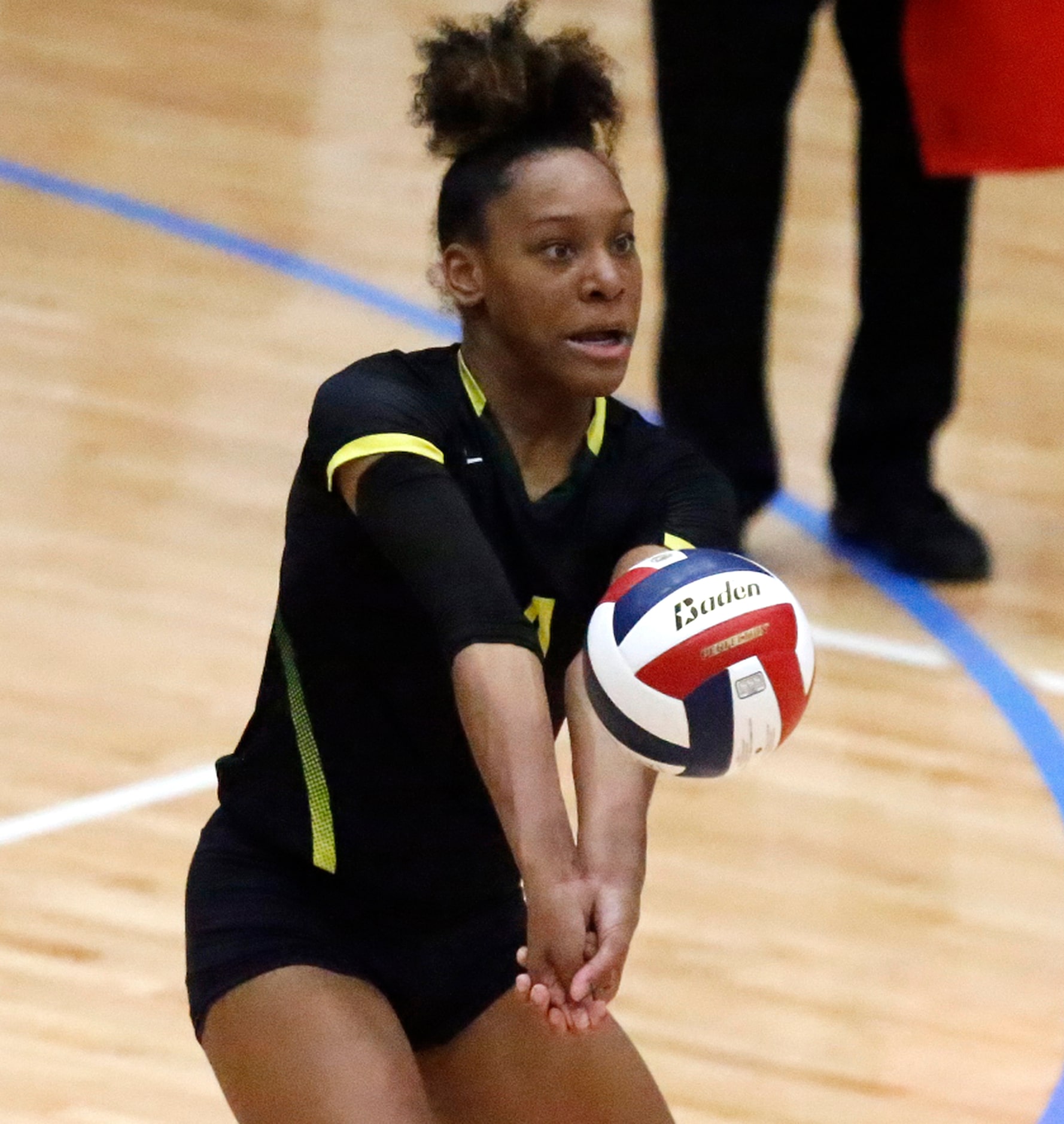 DeSoto High School outside hitter Caitlin Shaw (4) receives a serve during game two as...