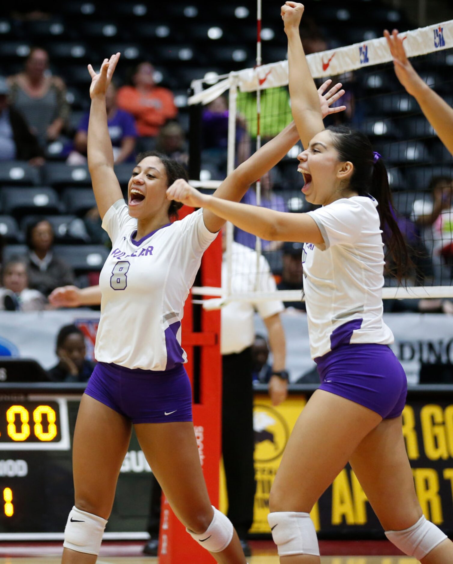 Kennedale Madeline Pyles (3) hits the ball over Lamar FulshearÃs Shelby Tally (13) and...