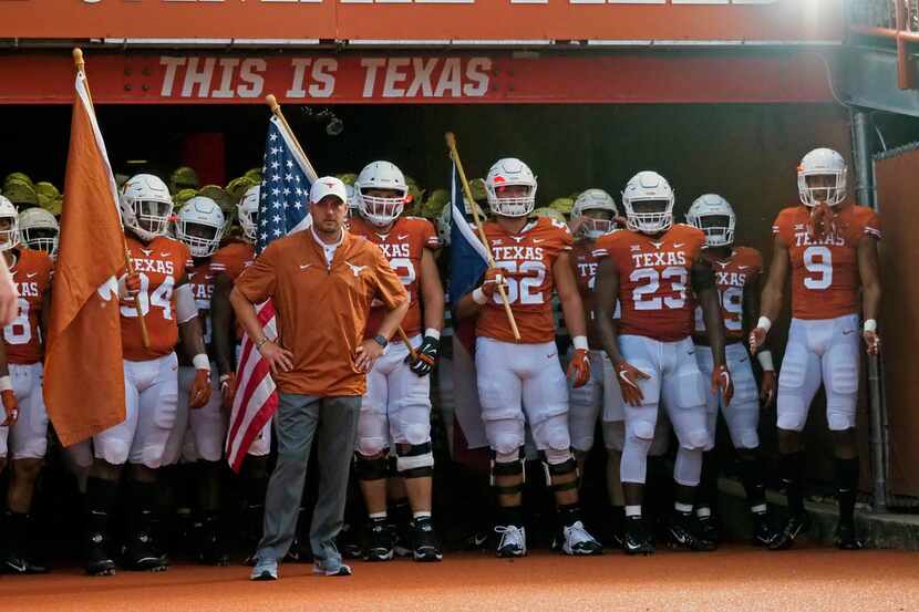 Texas coach Tom Herman waits with his team before an NCAA college football game against...