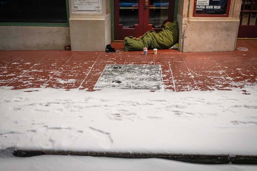 With temperatures falling into the single digits, a homeless person slept Feb. 14 in the...