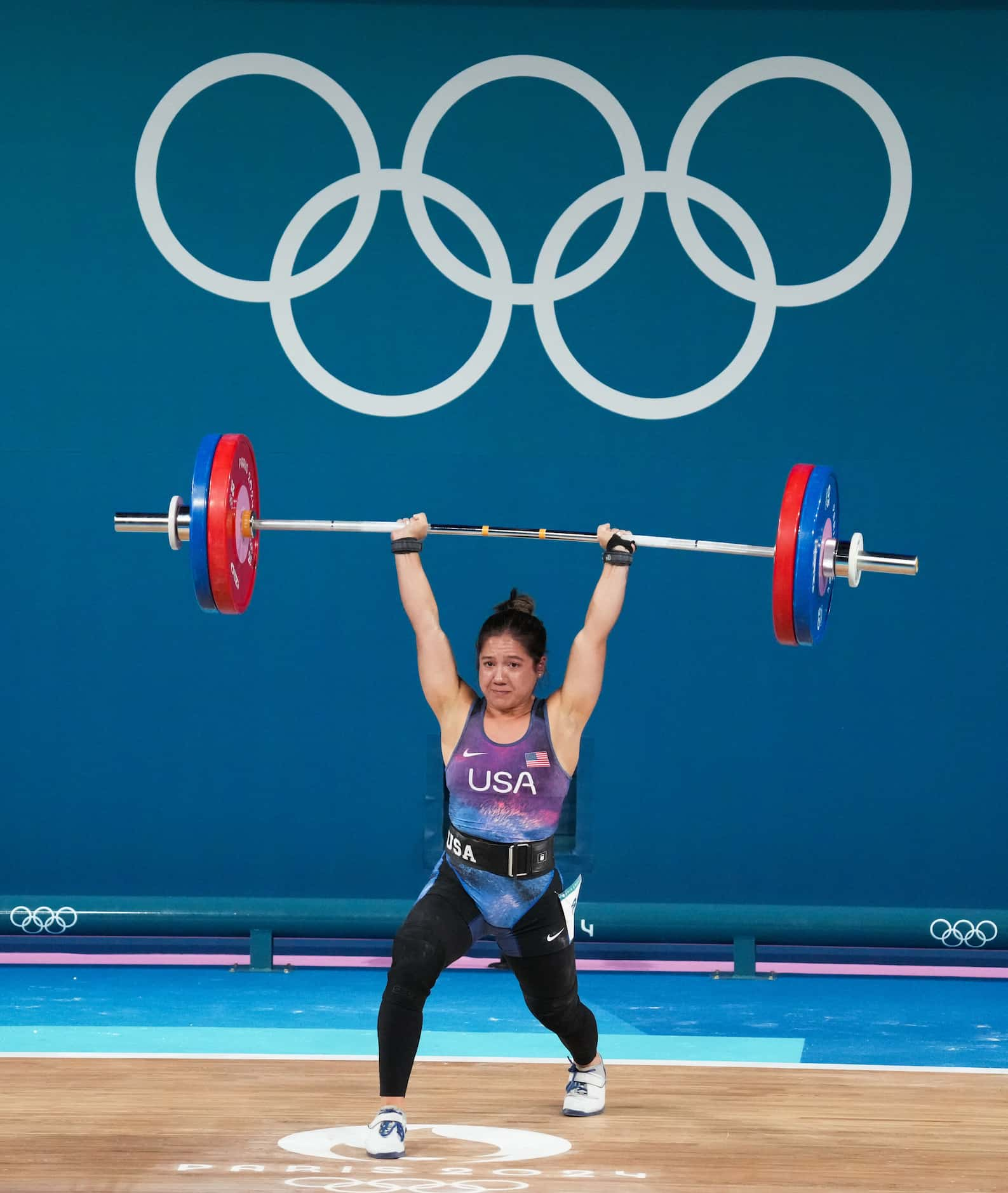 Jourdan Delacruz of the United States lifts 111kg in the clean and jerk during women’s 49kg...