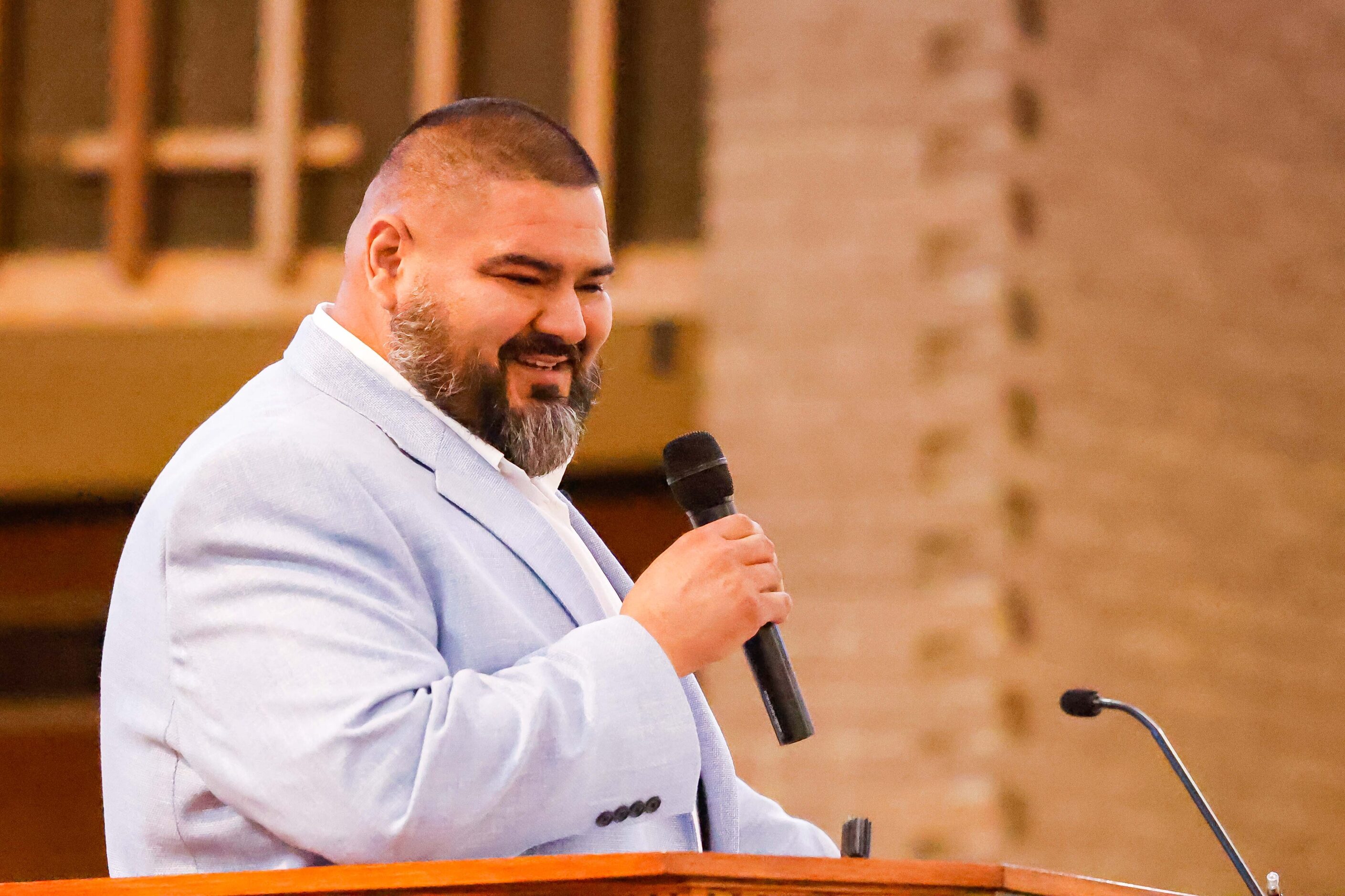 '06 alumni Claudio Urbina adresses attendees during the Paul Quinn College Founder's Day...