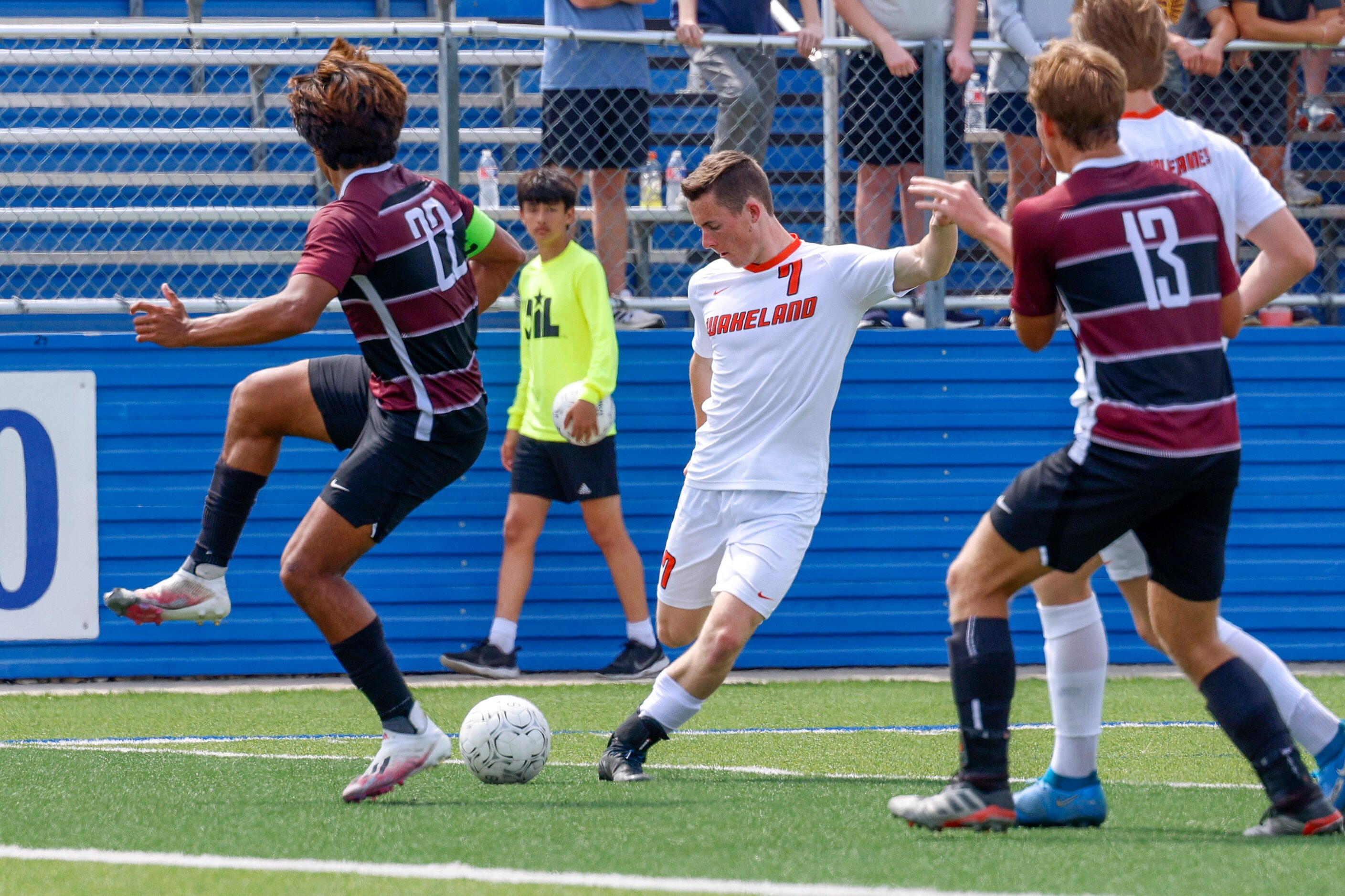 Frisco Wakeland forward Daniel Bayles (7) crosses the ball between Dripping Springs...