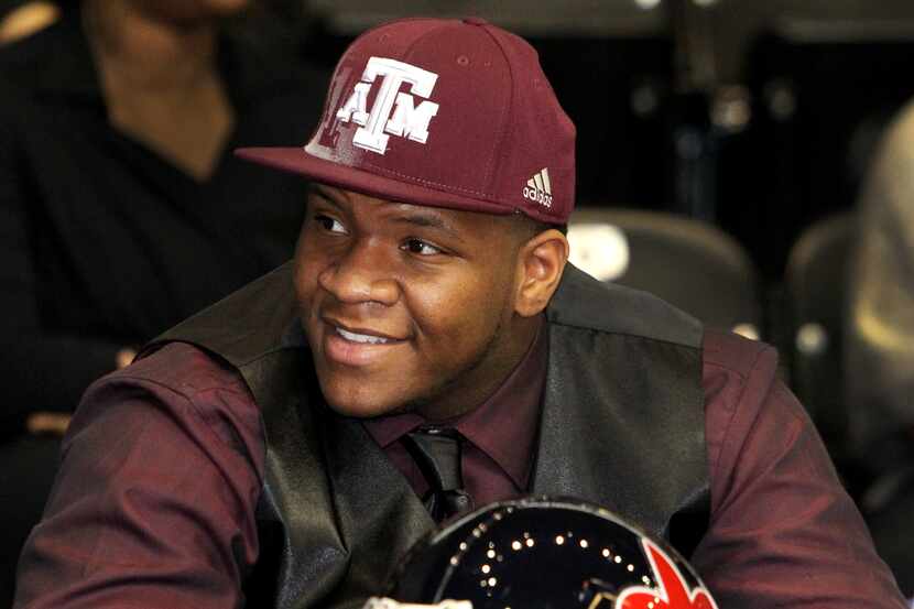 Kimball's Justin Manning, who committed to Texas A&M, is all smiles after being introduced...