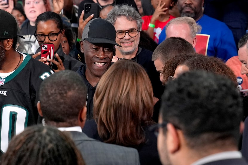 Democratic presidential nominee Vice President Kamala Harris, bottom center, greets actors...