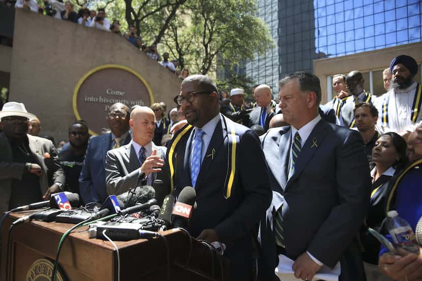 The Rev. Bryan Carter spoke at a vigil Friday at Thanks-Giving Square in Dallas, about a...