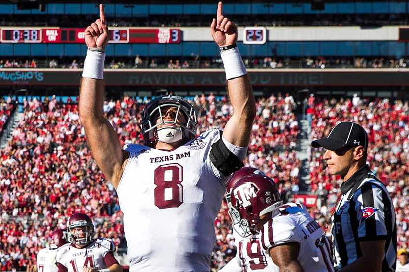 Texas A&M quarterback Trevor Knight (8) celebrates after a touchdown catch by wide receiver...