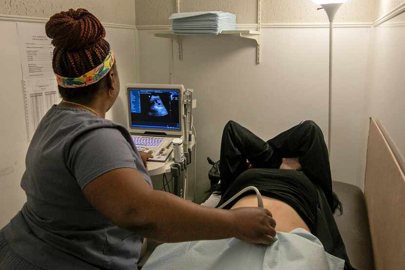 An operating room technician performs an ultrasound on a patient at Hope Medical Group for...