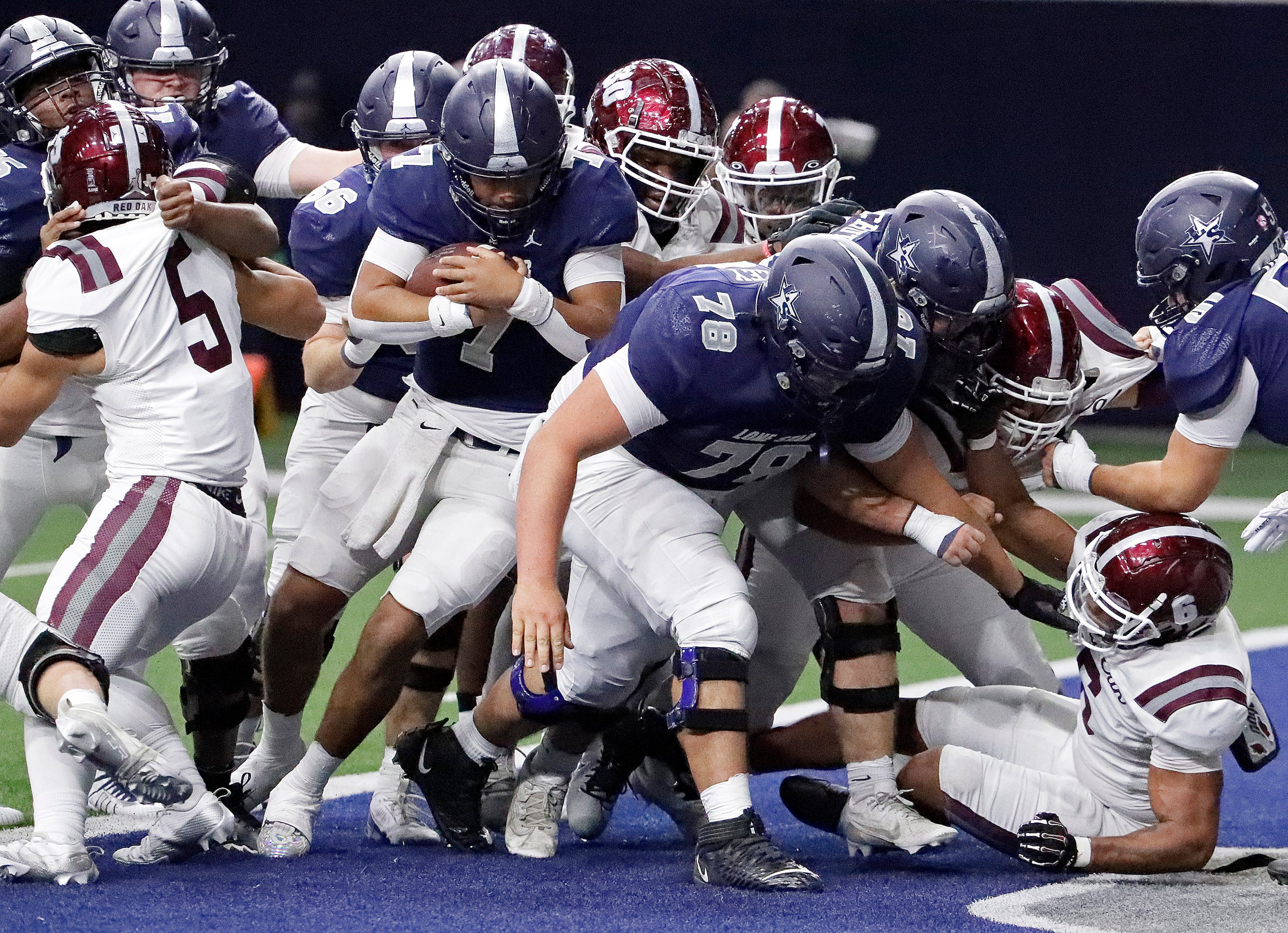 Lone Star High School quarterback Karece Hoyt (7) follows his blockers into the end zone for...