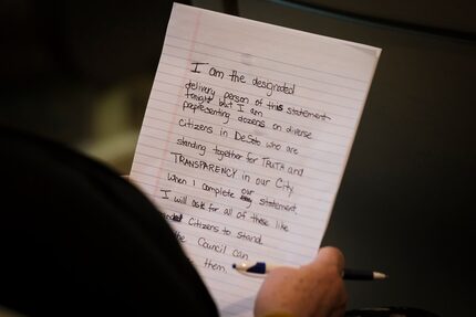 Cheri Simerly prepares her remarks to the DeSoto CIty Council on behalf of a citizens' group...