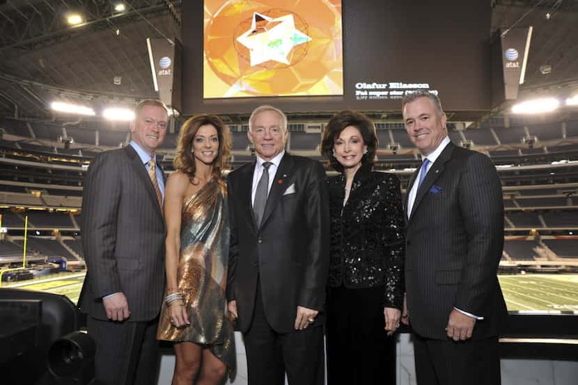 Dallas Cowboys owner Jerry Jones (center), flanked (from left to right) by son Jerry Jr.,...