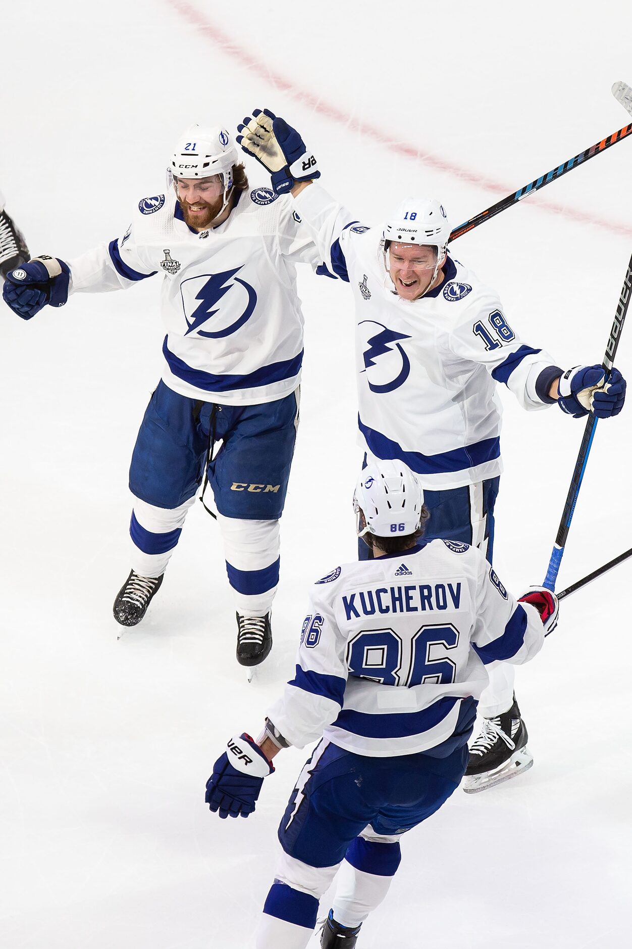 Brayden Point (21), Ondrej Palat (18) and Nikita Kucherov (86) of the Tampa Bay Lightning...