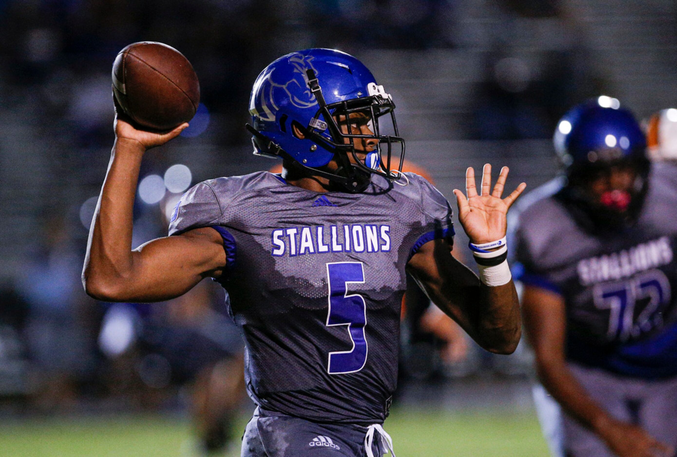 TXHSFB North Mesquite senior quarterback Kamaury Thompson (5) throws during the first half...