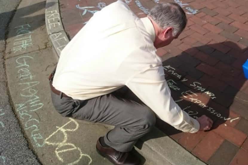 
Emory University President James Wagner’s response in chalk to protestors’ calls to censor...