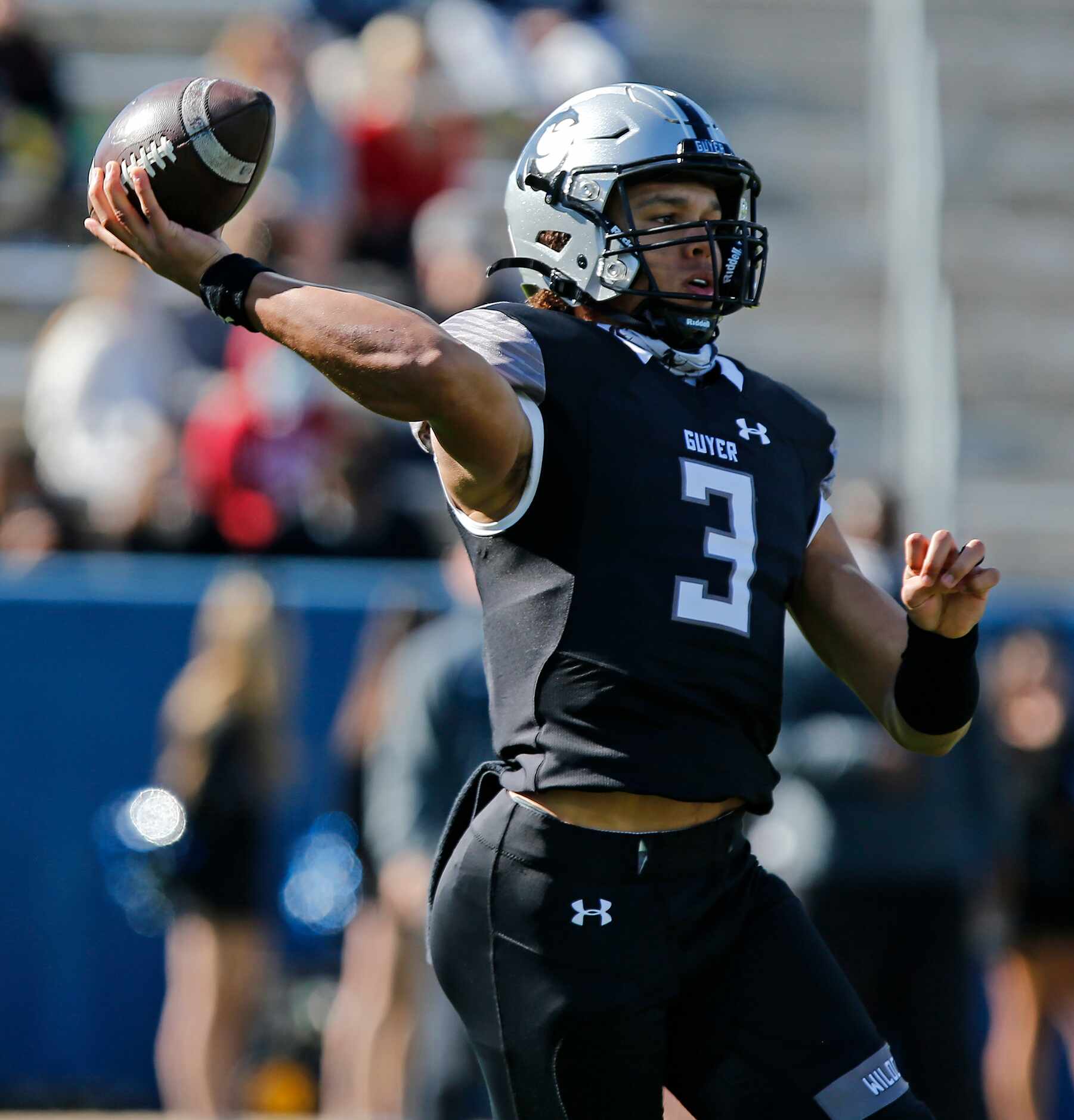 Denton Guyer High School quarterback Eli Stowers (3) throws a pass on the run during the...