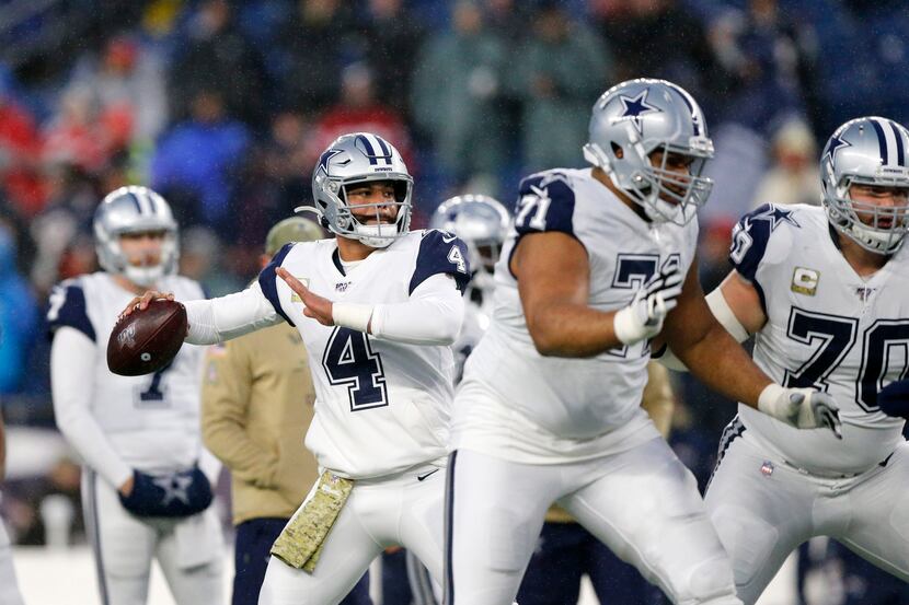Dallas Cowboys quarterback Dak Prescott (4) throws a pass during pregame warmups at Gillette...