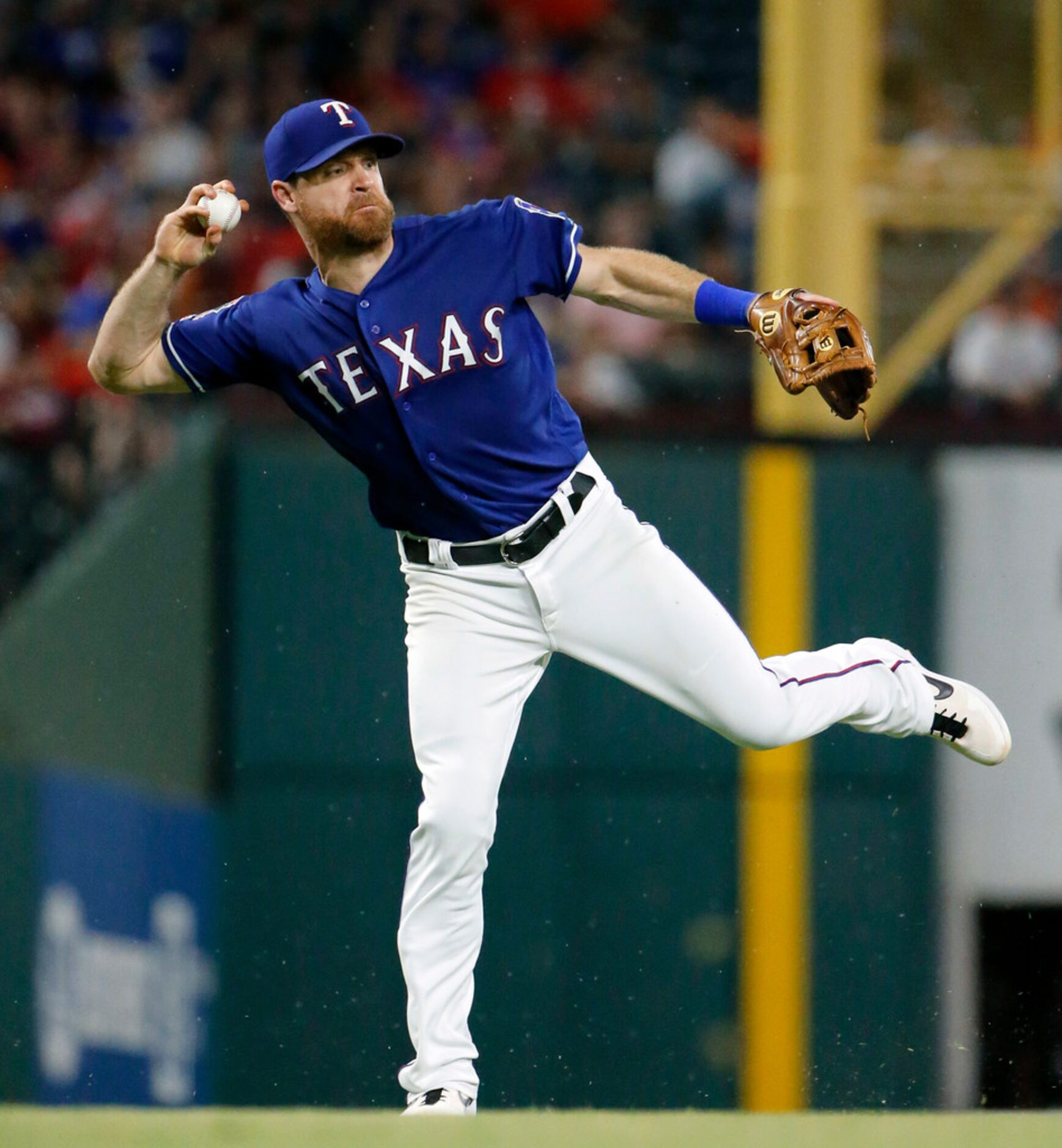 Texas Rangers first baseman Logan Forsythe (41) zips the ball to first in attempt to get...