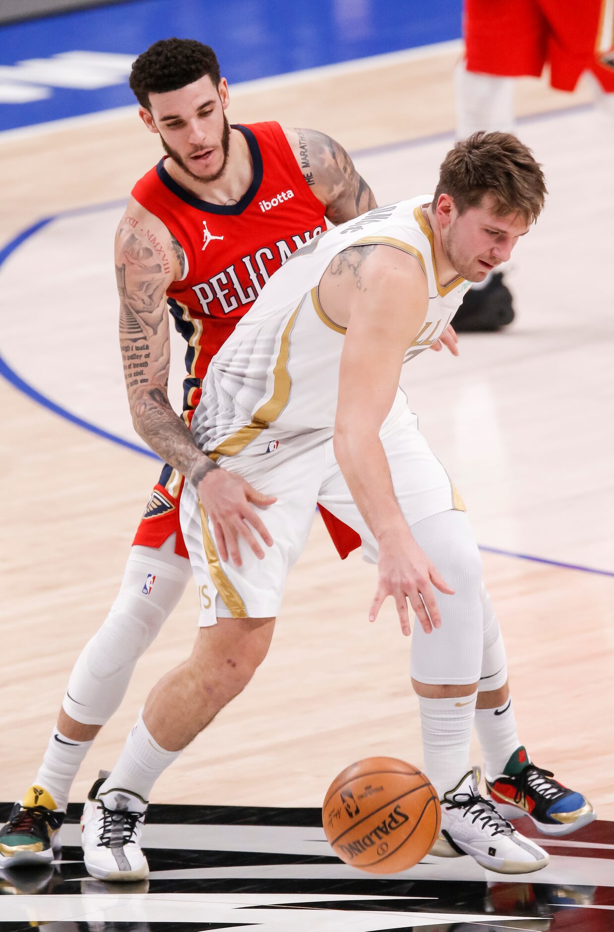 Dallas Mavericks guard Luka Doncic (77) battles New Orleans Pelicans guard Lonzo Ball (2)...