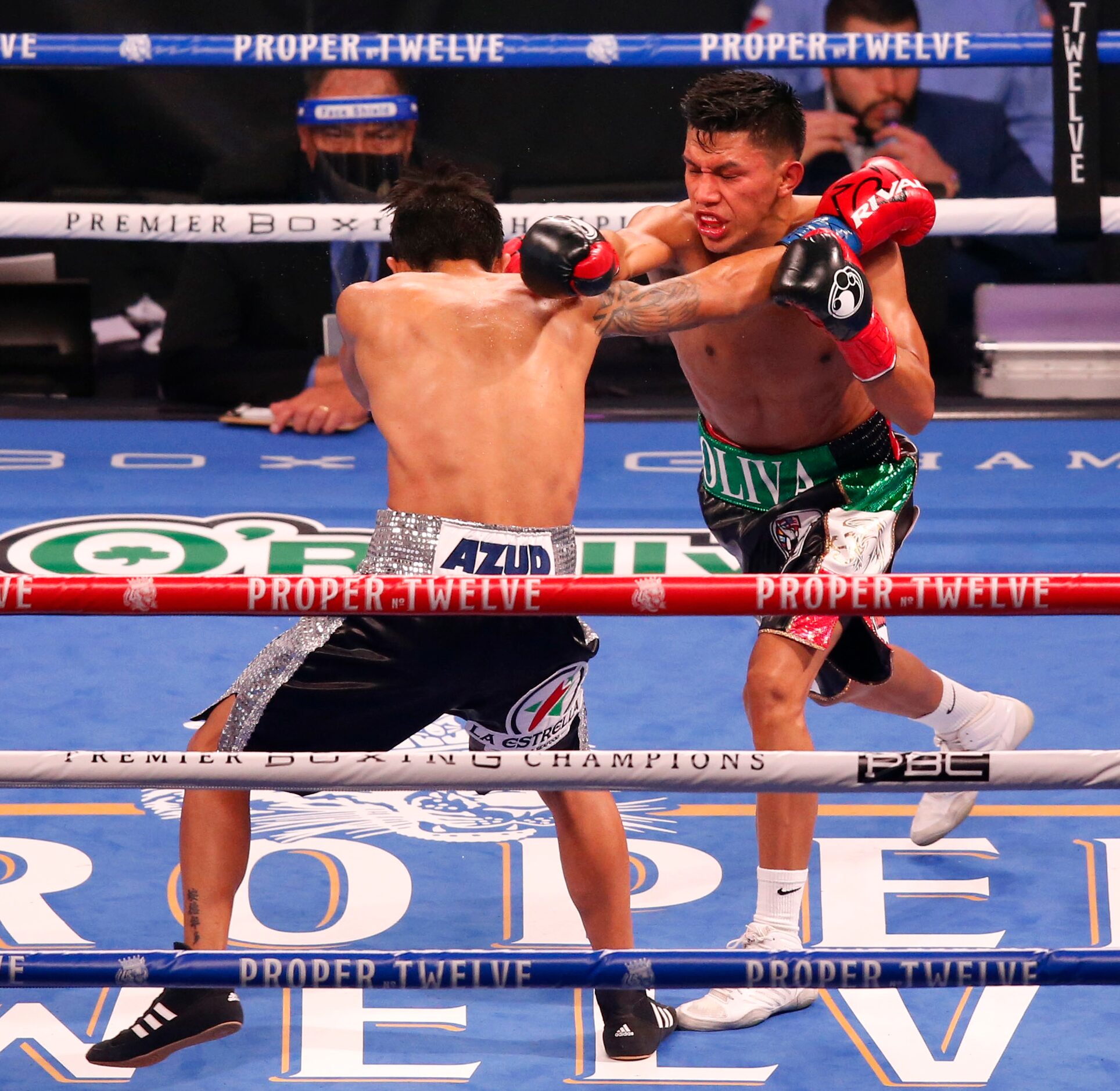 Miguel Flores throws a punch at Eduardo Ramirez during the third round at AT&T Stadium on...