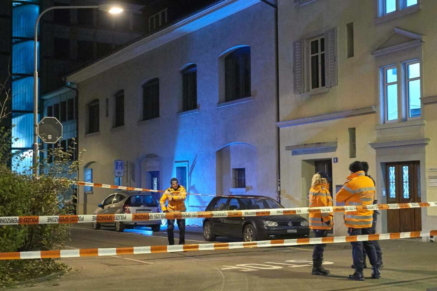 Swiss police are seen outside a Muslim prayer hall, central Zurich, on December 19, 2016,...