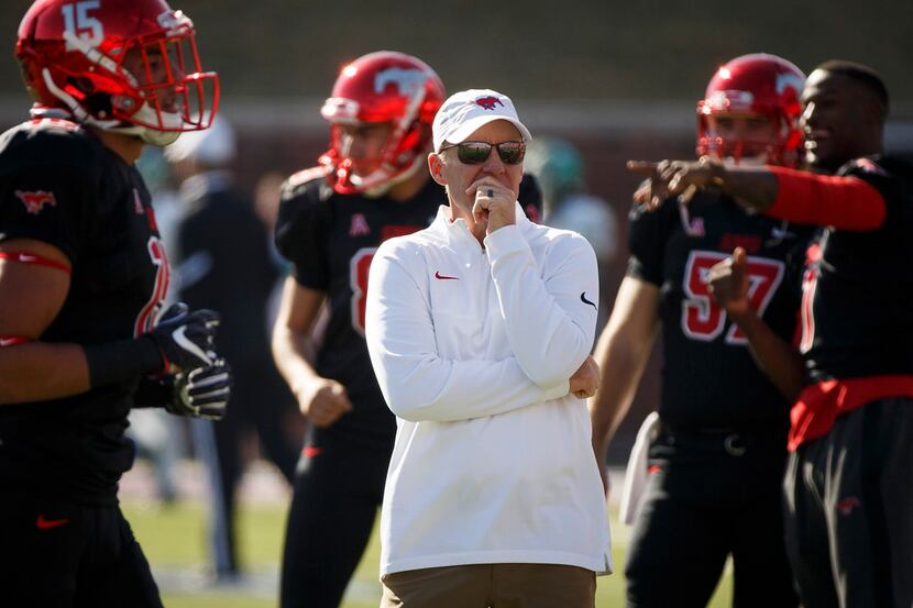 SMU head coach Chad Morris watches his team warm up before an NCAA football game against...