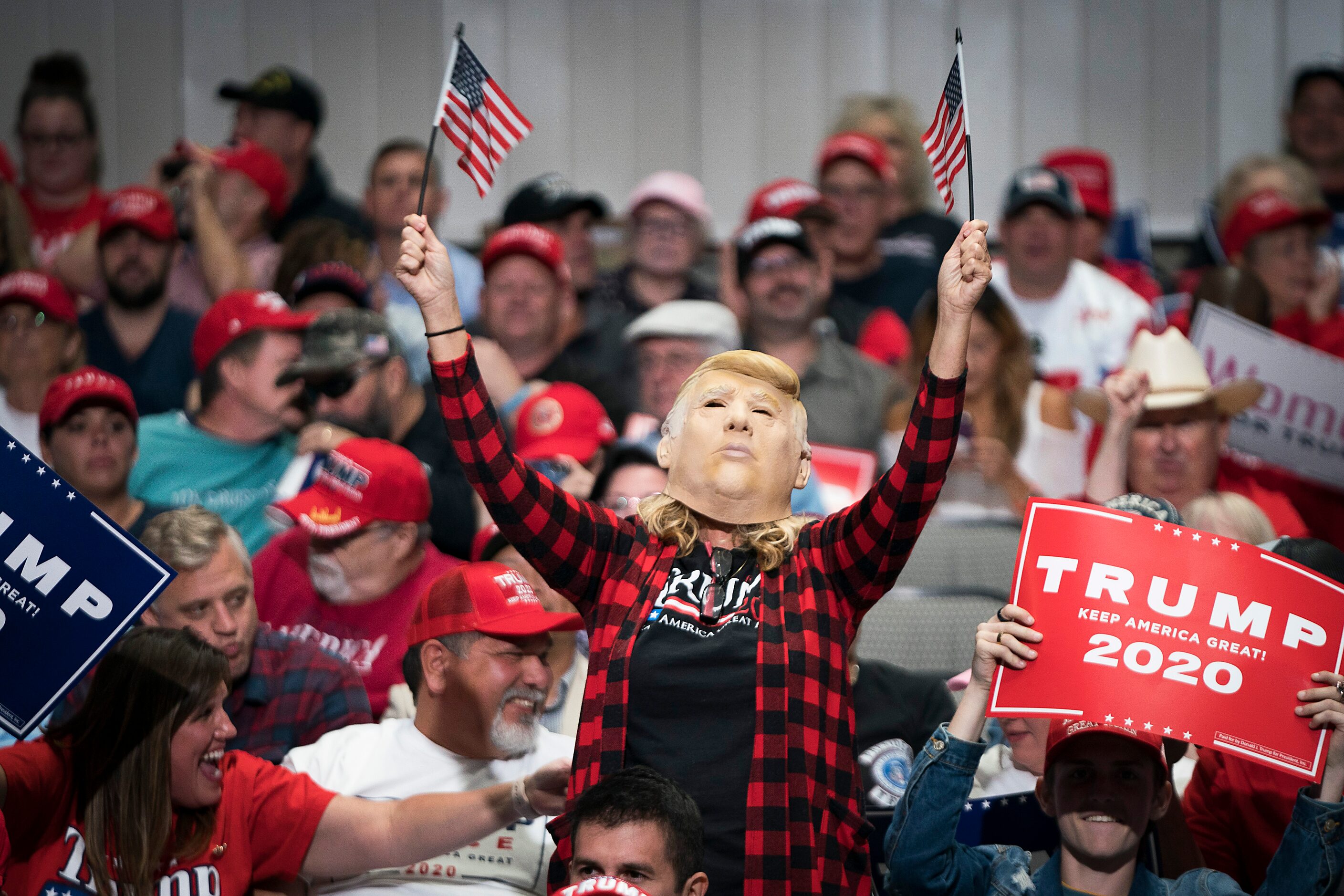 Supporters cheer President Donald Trump before his arrival at campaign rally at the American...