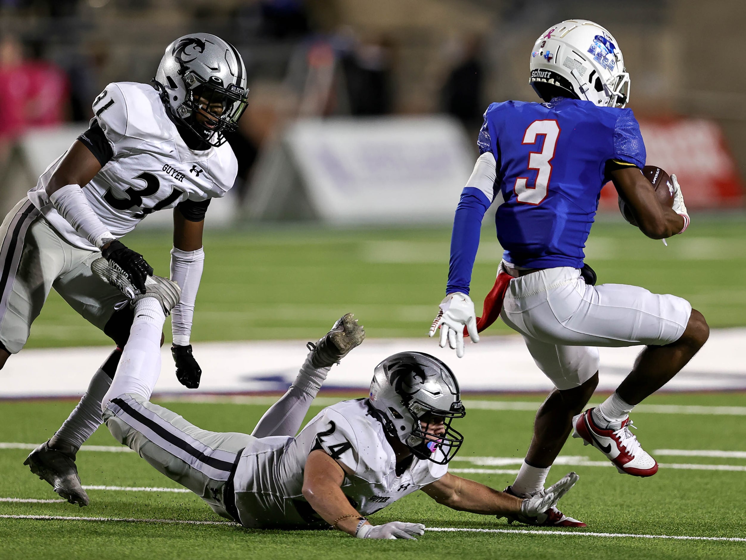 Allen wide receiver Caleb Smith (3) tries to avoid Denton Guyer defensive back Caleb Rowe...