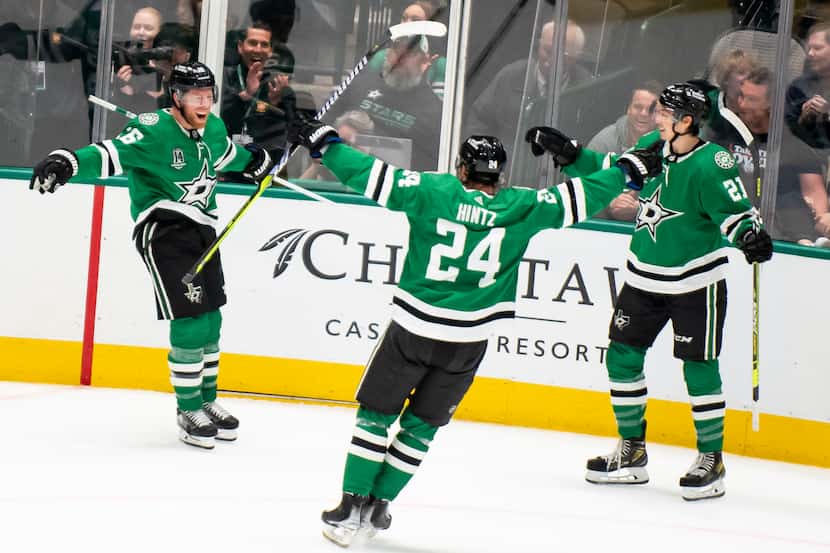 FILE - From left to right, Dallas Stars center Joe Pavelski (16) cheers after scoring a goal...