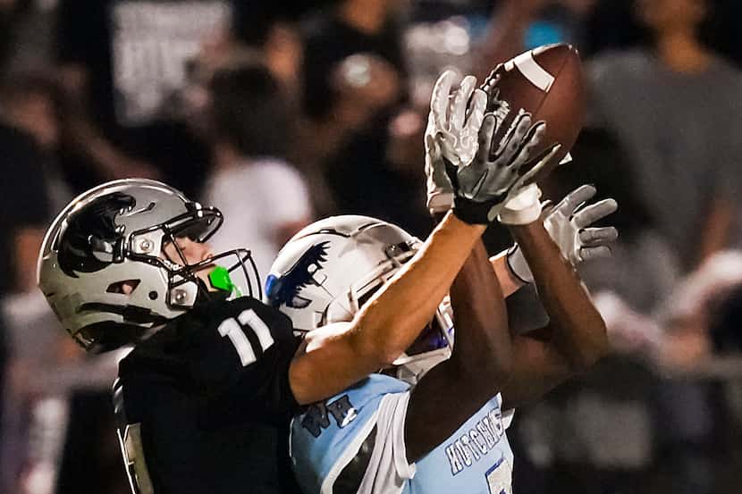 Panther Creek wide receiver Cristian Trickett (11) reaches for a pass as Wilmer-Hutchins’...