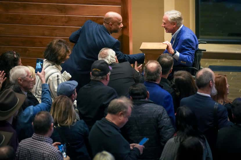 Texas Gov. Greg Abbott greets Dallas Morning News political reporter Gromer Jeffers after he...