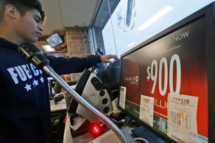  A Powerball lottery ticket is printed at a gas station in Dallas, Jan. 9. Ticket sales for...