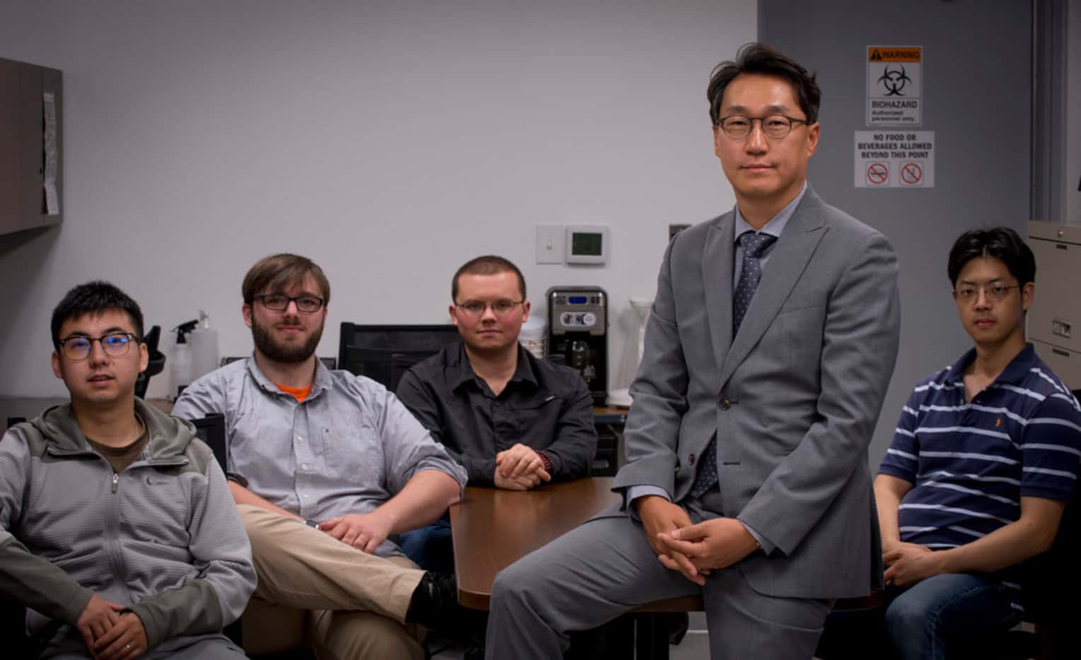 Minjun Kim, professor and Robert C. Womack chair in Engineering, poses with his team of...