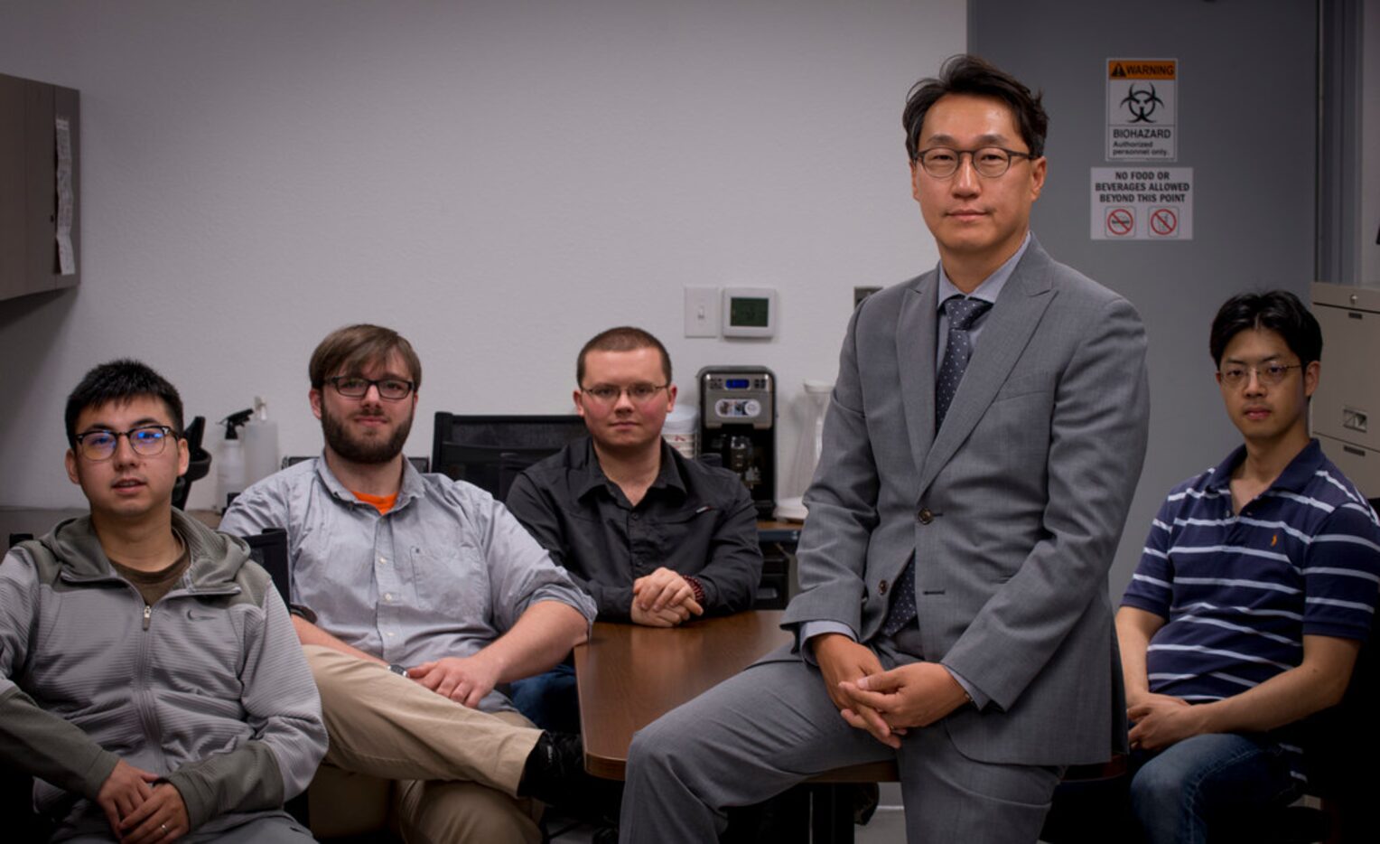 Minjun Kim, professor and Robert C. Womack chair in Engineering, poses with his team of...